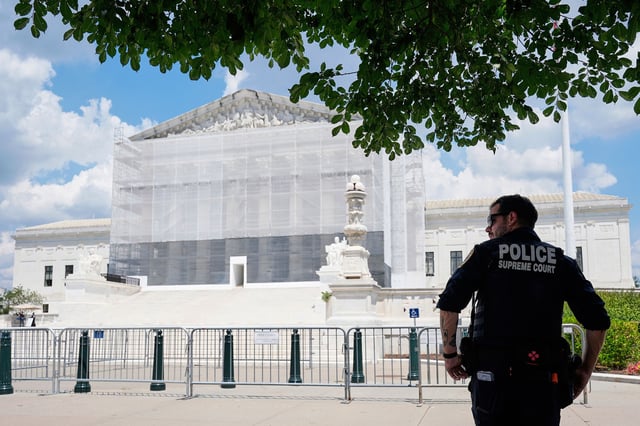 A US Supreme Court police officer stands watch outside of the Supreme Court on June 26 in Washington, DC.