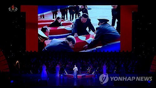 This footage, released by North Korea's Korean Central Television on June 30, 2025, shows North Korean leader Kim Jong-un mourning over a coffin believed to belong to a North Korean soldier killed in Russia, which was aired during an artists' performance held a day earlier at the East Pyongyang Grand Theater in the North's capital. (For Use Only in the Republic of Korea. No Redistribution) (Yonhap)