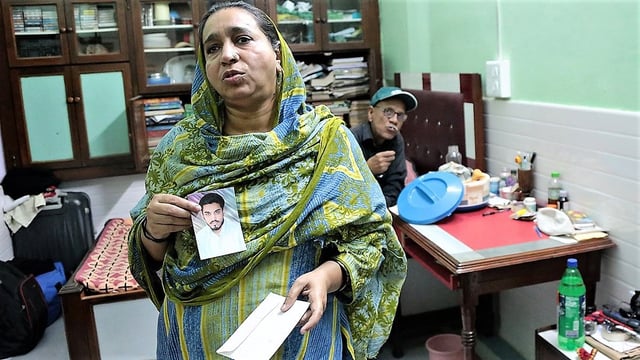 Najeeb’s mother Fatima Nafees and his father Nafees Ahmed show a photograph of their missing son in this file photo. | Manisha Mondal | ThePrint