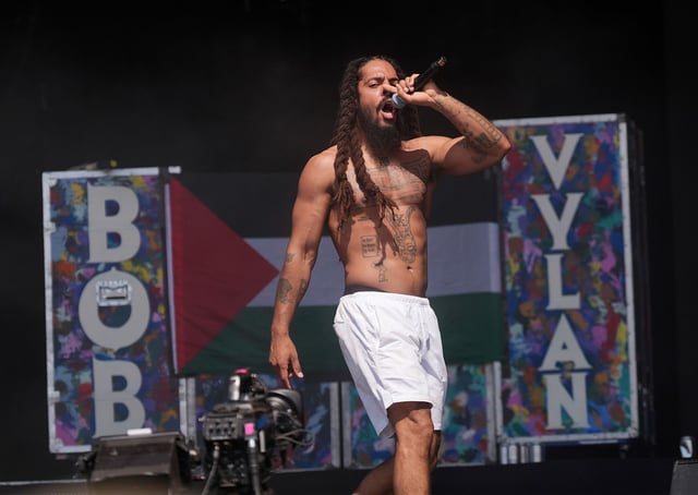 Previously unissued photo dated 28/6/2025 of Bob Vylan performing on the West Holts Stage, during the Glastonbury Festival at Worthy Farm in Somerset. Glastonbury Festival has said it is "appalled" by the statements made by Bobby Vylan, of punk duo Bob Vylan, during their set on Saturday. The performer led crowds on the festival's West Holts Stage in chants of "death, death to the IDF". Issue date: Sunday June 29, 2025. (Photo by Yui Mok/PA Images via Getty Images)