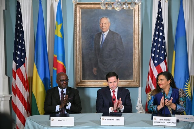 US Secretary of State Marco Rubio, Democratic Republic of the Congo Foreign Minister Therese Kayikwamba Wagner and Rwandan Foreign Minister Olivier Nduhungirehe applaud after signing a peace agreement in Washington