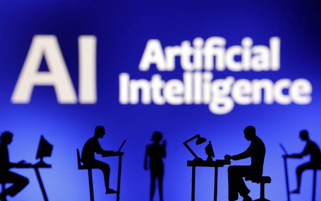 Figurines with computers and smartphones are seen in front of the words "Artificial Intelligence AI" in this illustration taken, February 19, 2024. REUTERS/Dado Ruvic/Illustration/File Photo