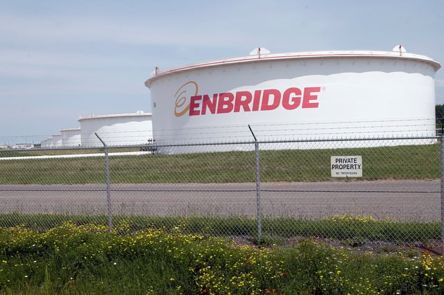 FILE - The corporate name stands out on tanks shown June 29, 2018 at at the Superior terminal of Enbridge Energy in Superior, Wis. (AP Photo/Jim Mone, File)