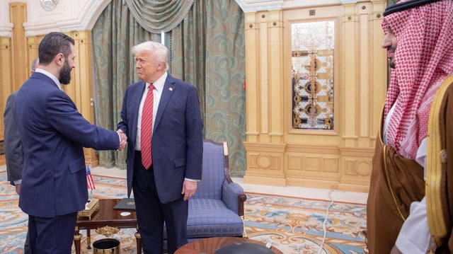 Trump meets with Syrian President Ahmed al-Shara (L) along with Saudi Crown Prince Mohammed bin Salman during a trip to the region in May. Photo: Bandar Al-Jaloud/Saudi Royal Court/Handout/Anadolu via Getty Images