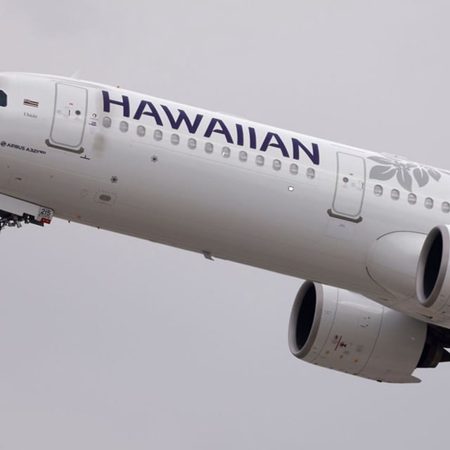 A Hawaiian Airlines plane taking off.