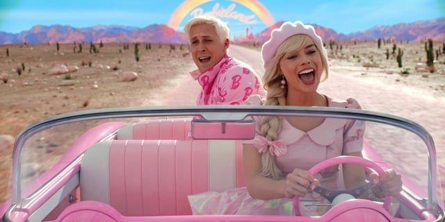 Barbie (Margot Robbie) singing her car with Ken (Ryan Gosling) behind her in Greta Gerwig's Barbie