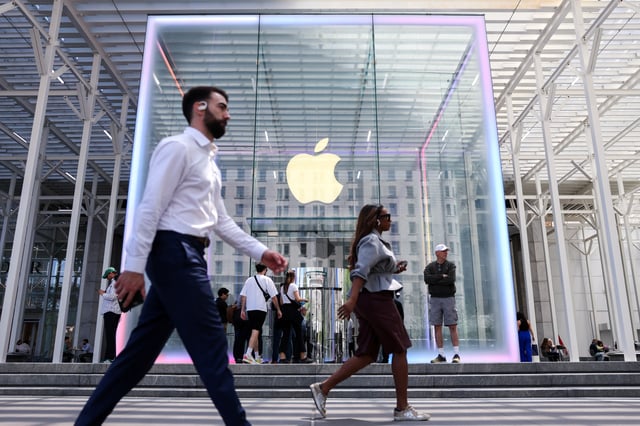 People walk by the Apple store on Fifth Avenue in New York City, U.S., May 1, 2025. REUTERS/Kylie Cooper/ File Photo