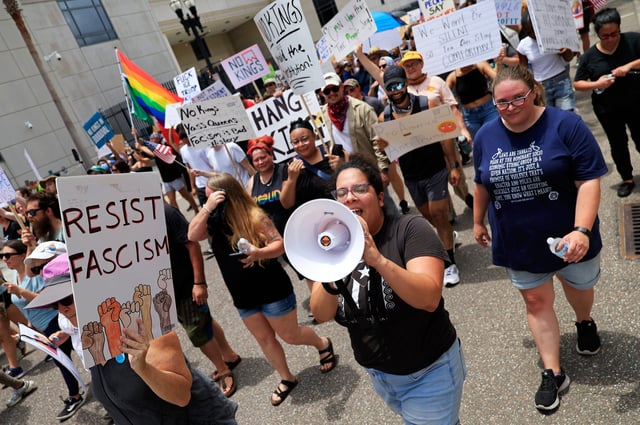 Maria Garcia of Jacksonville Immigrant Rights Alliance leads a protest march during a "No Kings" protest outside the Duval County Courthouse Saturday, June 14, 2025 in Jacksonville, Fla. People took part in one of nearly 2,000 nationwide rallies against Trump and his administration.