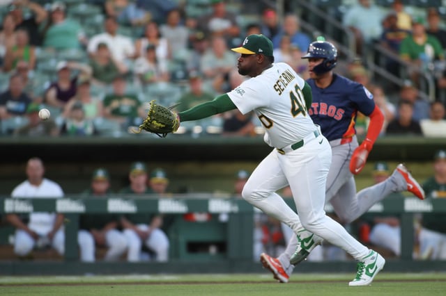Athletics pitcher Luis Severino flips to catcher Austin Wynns, not pictured, for an out against the Houston Astros, Wednesday, June 18, 2025, in West Sacramento, Calif.