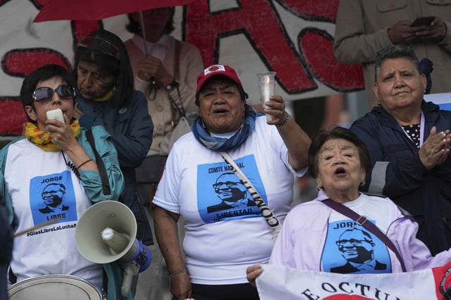 Supporters of former Vice President of Ecuador Jorge Glas gather outside court where he attends his sentencing after he was convicted of embezzlement during his oversight of earthquake reconstruction in Quito, Ecuador, Monday, June 30, 2025. (AP Photo/Dolores Ochoa)