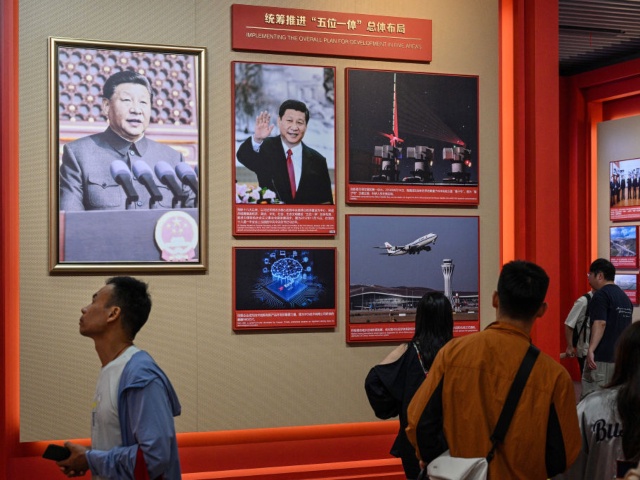 People visit the Museum of the First National Congress of the Chinese Communist Party on China's National Day, marking the 75th anniversary of the founding of the People's Republic of China, in Shanghai on October 1, 2024. (Photo by Hector RETAMAL / AFP) (Photo by HECTOR RETAMAL/AFP via Getty Images)