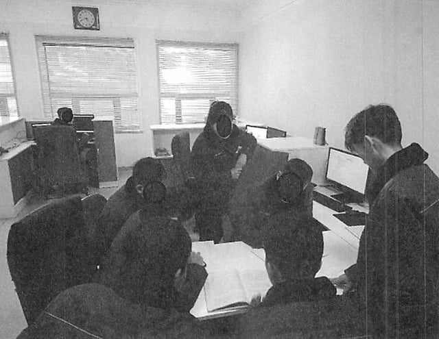 This photo from the US District Court District of Massachusetts shows North Korean information technology workers on a multi-member team that the US Department of Justice says works with the North Korean government to fund its regime. Note: Parts of the image provided by the US District Court District of Massachusetts have been obscured.