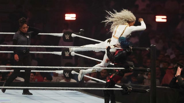 US wrestler Jade Cargill (L) fights against Japanese wrestler Asuka for the undisputed WWE Championship Queen of the Ring at Kingdom Arena in Riyadh on June 28, 2025.