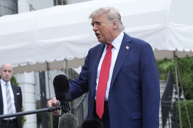 President Donald Trump speaks with reporters as White House Deputy Chief of Staff Stephen Miller listens before departing the White House on his way to attend the G7 Summit in Canada, Sunday, June 15, 2025, in Washington. (AP Photo/Manuel Balce Ceneta)