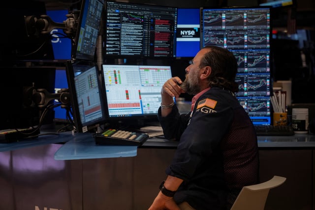 A trader works on the floor at the New York Stock Exchange (NYSE) in New York City, U.S., June 27, 2025. REUTERS/Jeenah Moon/ File Photo