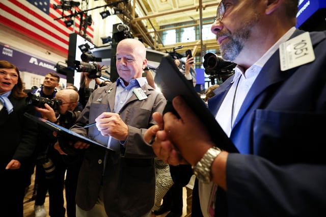 Traders work on the floor of the New York Stock Exchange at the opening bell on June 23, 2025.  