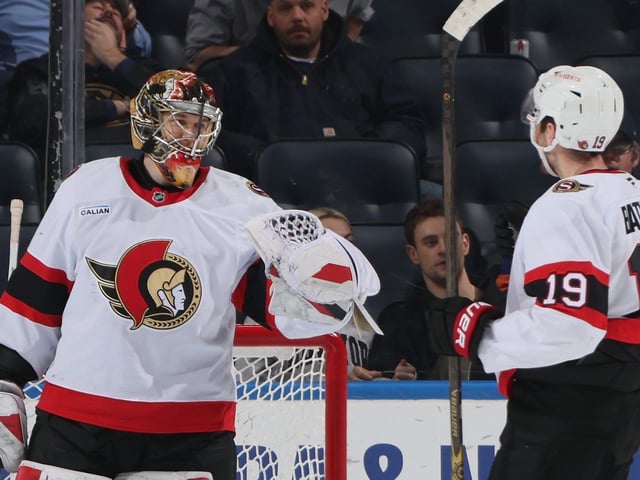 Leevi Merilainen #1 of the Ottawa Senators celebrates his 2-0 shutout against the New York Islanders and is joined by Drake Batherson #19 at UBS Arena  in Elmont, New York.