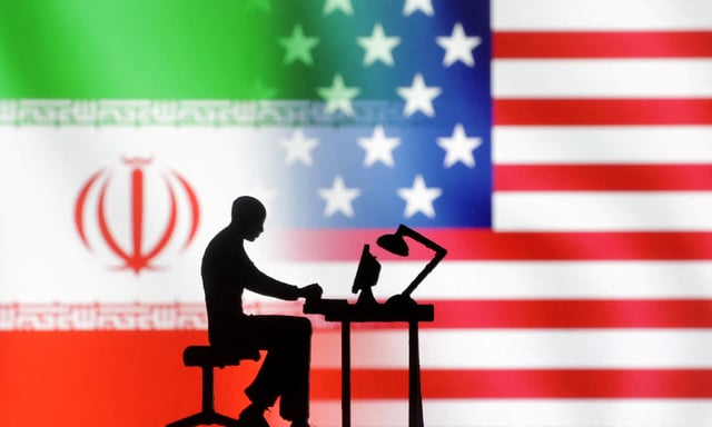 Figurines with computers are seen in front of USA and Iran flags in this illustration taken, September 10, 2022. REUTERS/Dado Ruvic/Illustration/File Photo