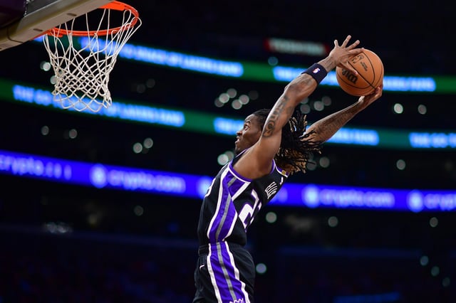 Dec 28, 2024; Los Angeles, California, USA; Sacramento Kings guard Keon Ellis (23) dunks for the basket against the Los Angeles Lakers during the first half at Crypto.com Arena. Mandatory Credit: Gary A. Vasquez-Imagn Images
