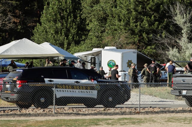 Law enforcement officers gather at Cherry Hill Park after multiple firefighters were attacked when responding to a fire in the Canfield Mountain area outside Coeur d’Alene, Idaho, U.S. June 29, 2025.  REUTERS/Young Kwak/File Photo