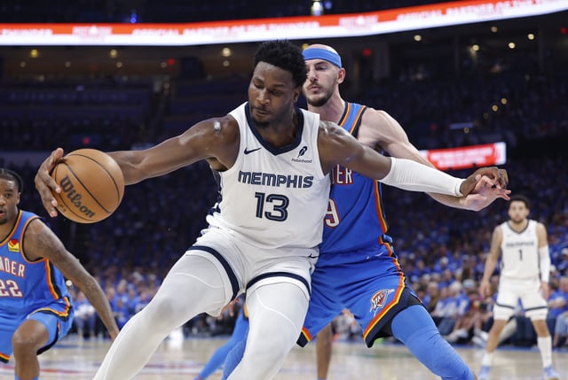 Apr 22, 2025; Oklahoma City, Oklahoma, USA; Memphis Grizzlies forward Jaren Jackson Jr. (13) moves the ball against Oklahoma City Thunder guard Alex Caruso (9) in the third quarter during game two of first round for the 2024 NBA Playoffs at Paycom Center. Mandatory Credit: Alonzo Adams-Imagn Images/File Photo