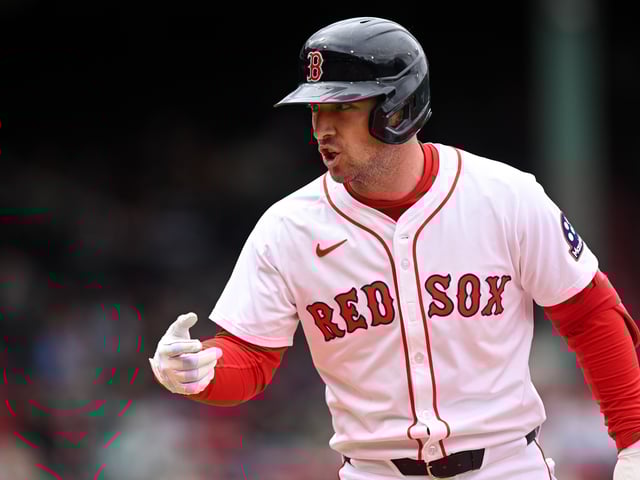 BOSTON, MASSACHUSETTS - MAY 23: Alex Bregman #2 of the Boston Red Sox calls to the dugout for a trainer after hitting a single against the Baltimore Orioles during the fifth inning at Fenway Park on May 23, 2025 in Boston, Massachusetts.