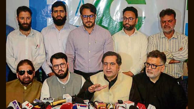 JKPC chief Sajad Lone along with PDF president Hakeem Mohammad Yaseen, Jamaat-e-Islami-backed JDF’s chief Shamim Ahmad Thokar during a press conference in Srinagar on Monday. (PTI)