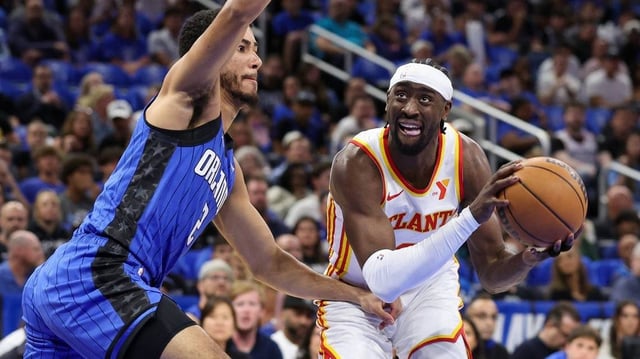 Apr 15, 2025; Orlando, Florida, USA; Orlando Magic guard Caleb Houstan (2) guards Atlanta Hawks guard Caris LeVert (3) in the first quarter at Kia Center. Mandatory Credit: Nathan Ray Seebeck-Imagn Images
