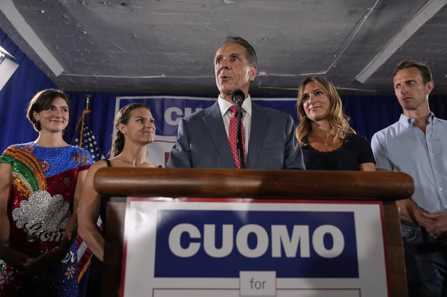 Joined by his daughters, from left, Michaela Kennedy-Cuomo, Cara Kennedy-Cuomo, Mariah Kennedy-Cuomo and son-in-law Tellef Lundevall, mayoral candidate Andrew Cuomo, center, speaks to supporters during a Democratic primary watch party, Tuesday, June 24, 2025, in New York. (AP Photo/Yuki Iwamura)