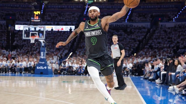 Timberwolves guard Nickeil Alexander-Walker saves the ball against the Oklahoma City Thunder.