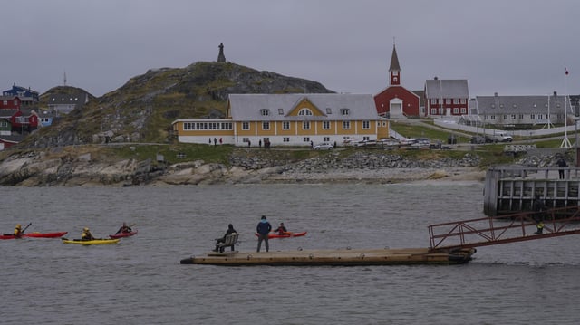 Tourists kayak at sea in front of Nuuk Cathedral in Nuuk, Greenland, Monday, June 16, 2025. (AP Photo/Kwiyeon Ha)