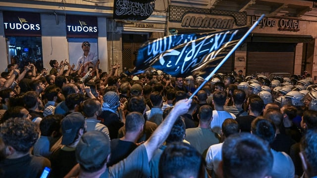 Islamist protesters clash with Turkish anti riot police officers as they gather to protests Leman cartoon magazine in Istanbul.