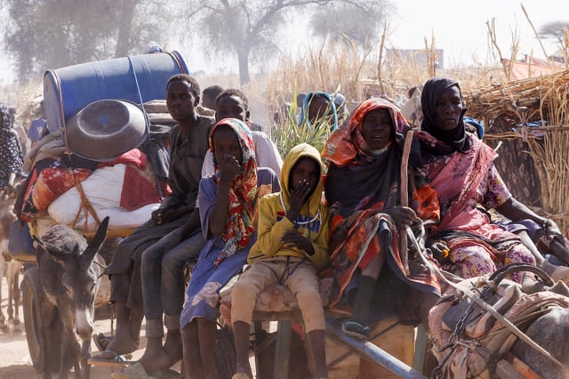 Displaced people ride a an animal-drawn cart, following Rapid Support Forces (RSF) attacks on Zamzam displacement camp, in the town of Tawila, North Darfur, Sudan April 15, 2025. REUTERS/Stringer/File Photo