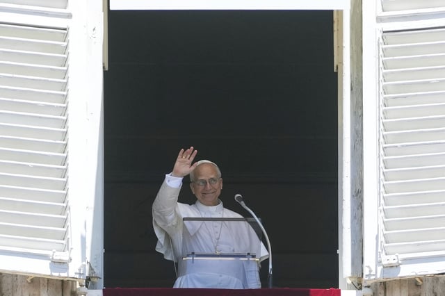 Pope Leo XIV appears at his studio's window to bless the faithful gathered in St. Peter's Square at the Vatican, Sunday. (AP Photo/Andrew Medichini)