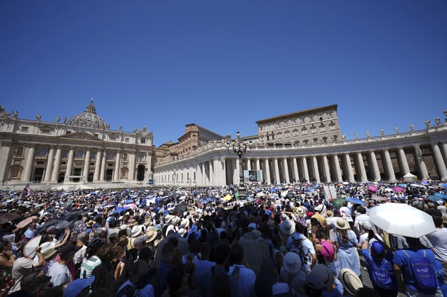 Faithful gather in St. Peter's Square at the Vatican waiting for Pope Leo XIV to appear at his studio's window, Sunday. (AP Photo/Andrew Medichini)
