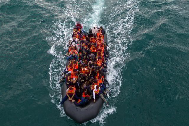 In this drone view an inflatable dinghy carrying migrants makes its way towards England in the English Channel, Britain, August 6, 2024. REUTERS/Chris J. Ratcliffe/File Photo