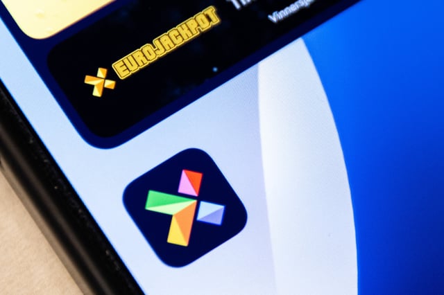 The logo of Norwegian lottery company Norsk Tipping sits next to the Eurojackpot logo on a smartphone display in Oslo, Norway.