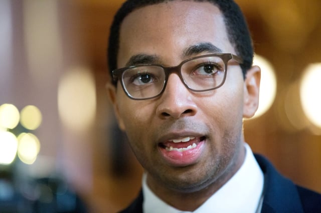 Then-state Rep. Christian Mitchell speaks to members of the press after Illinois Governor Bruce Rauner gave his budget address to lawmakers in the House of Representatives, Feb. 15, 2017, at the Illinois State Capitol in Springfield. (Erin Hooley/Chicago Tribune)