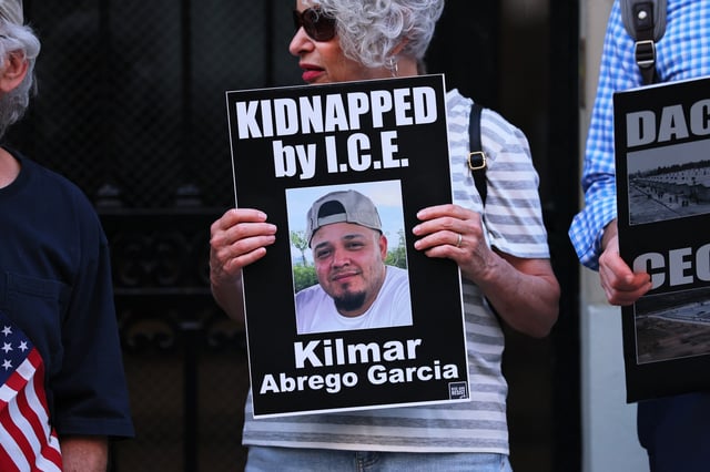 A protester holds a photo of Maryland man Kilmar Abrego Garcia as demonstrators gather to protest against the deportation of immigrants to El Salvador outside the Permanent Mission of El Salvador to the United Nations on April 24, 2025, in New York City.
