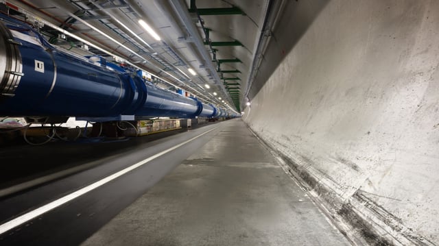 Inside the LHC tunnel at CERN, where particles are accelerated for high-energy collision experiments.