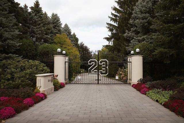 A gate with the number 23 controls access to the home of basketball legend Michael Jordan in Highland Park, Ill., on Oct. 21, 2013.