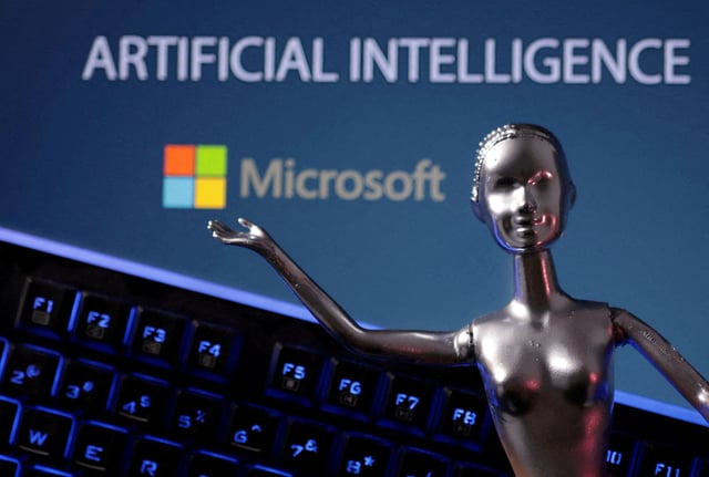 Microsoft logo and AI Artificial Intelligence words are seen in this illustration taken, May 4, 2023. REUTERS/Dado Ruvic/Illustration/File Photo