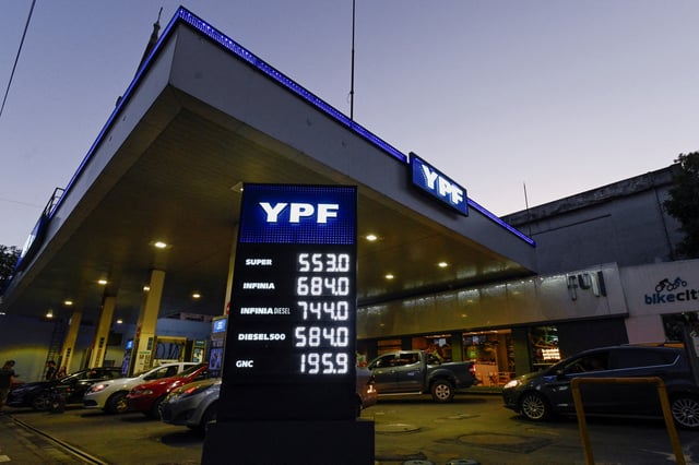 Petrol prices are seen on a billboard at a YPF gas station, as Argentina is battling with an annual inflation heading towards 200%, in Buenos Aires, Argentina December 29, 2023. REUTERS/Martin Cossarini/File Photo