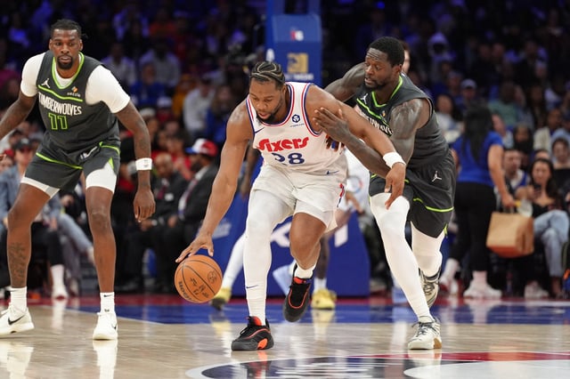 Apr 5, 2025; Philadelphia, Pennsylvania, USA; Philadelphia 76ers forward Guerschon Yabusele (28) shields the ball from Minnesota Timberwolves forward Julius Randle (30) in the third quarter at Wells Fargo Center. Mandatory Credit: Kyle Ross-Imagn Images/File Photo