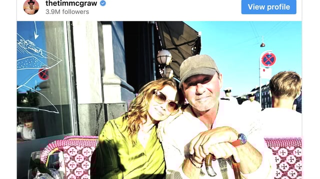Tim McGraw shares photo of himself with his wife and a cane.