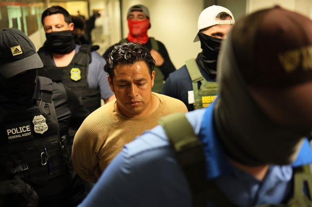 Federal agents detain a man after attending a court hearing at immigration court at the Jacob K. Javitz Federal Building on July 01, 2025 in New York City. S
