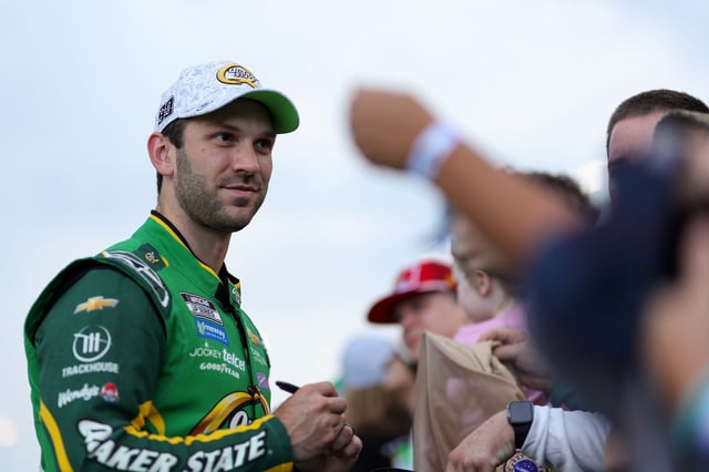 Daniel Suarez, driver of the #99 Quaker State Chevrolet, greets fans prior to the NASCAR Cup Series Quaker State 400 Available at Walmart at Echo Park Speedway on June 28, 2025 in Hampton, Georgia.