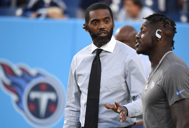 Oct 18, 2021; Nashville, Tennessee, USA; NFL Hall of Fame receiver Randy Moss talks with Tennessee Titans wide receiver A.J. Brown (11) before the game against the Buffalo Bills at Nissan Stadium. Mandatory Credit: Christopher Hanewinckel-USA TODAY Sports/File Photo
