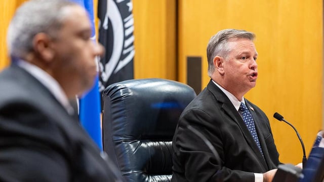 Roderick Miles Jr., the Tarrant County Commissioner of Precinct 1, and Tim O’Hare, the Tarrant County Judge, listen to public comment during a Commissioners Court Meeting at the Tarrant County Administration Building in Fort Worth on Tuesday, May 6, 2025.