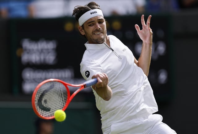 Tennis - Wimbledon - All England Lawn Tennis and Croquet Club, London, Britain - July 1, 2025 Taylor Fritz of the U.S. in action during his first round match against France's Giovanni Mpetshi Perricard REUTERS/Stephanie Lecocq
